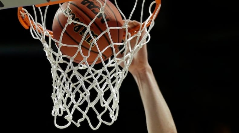 A Gonzaga player drops a ball in the basket during college basketball practice, Thursday, March 24, 2016, in Chicago. Gonzaga plays against Syracuse in a regional semifinal game in the NCAA Tournament on Friday. (AP Photo/Nam Y. Huh)