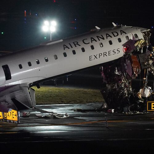 FILE - An Air Canada Jet sits on the runway at LaGuardia Airport, Monday, March 23, 2026, after colliding with a Port Authority aircraft rescue and firefighting vehicle after landing in New York. (AP Photo/Ryan Murphy, File)