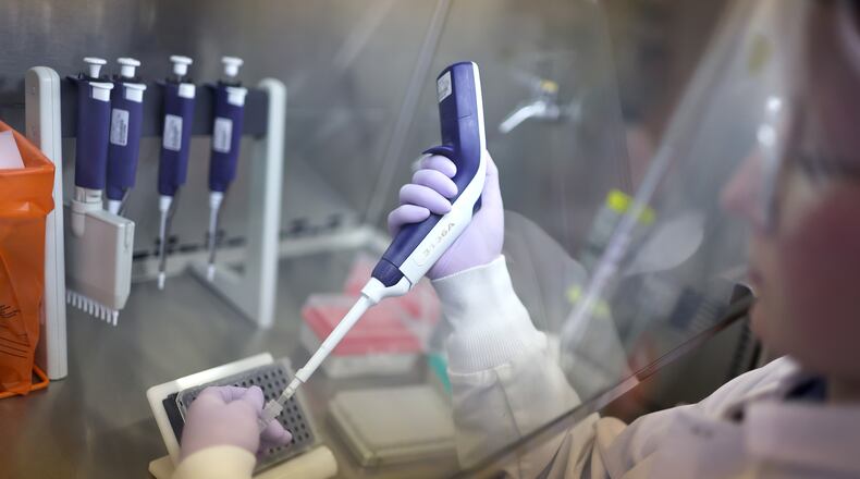 Microbiologist Anne Vandenburg-Carroll tests poultry samples collected from a farm located in a control area for the presence of H5N1 avian influenza, or bird flu, at the Wisconsin Veterinary Diagnostic Laboratory at the University of Wisconsin-Madison on March 24, 2022 in Madison, Wisconsin. (Scott Olson/Getty Images/TNS)