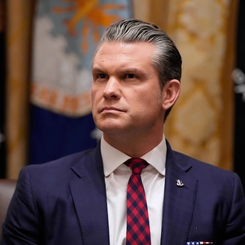 Defense Secretary Pete Hegseth listens as President Donald Trump speaks during a Cabinet meeting at the White House, Tuesday, Dec. 2, 2025, in Washington. (AP Photo/Julia Demaree Nikhinson)