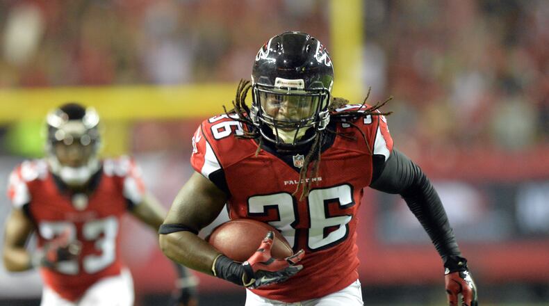 Falcons defensive back Kemal Ishmael (36) runs for a touchdown against the Tampa Bay Buccaneers. HYOSUB SHIN / HSHIN@AJC.COM