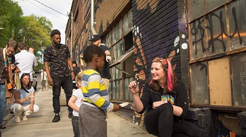 Artist Karen Anderson Singer works closely with the community when installing a new Tiny Door.
Courtesy Steve Eberhardt