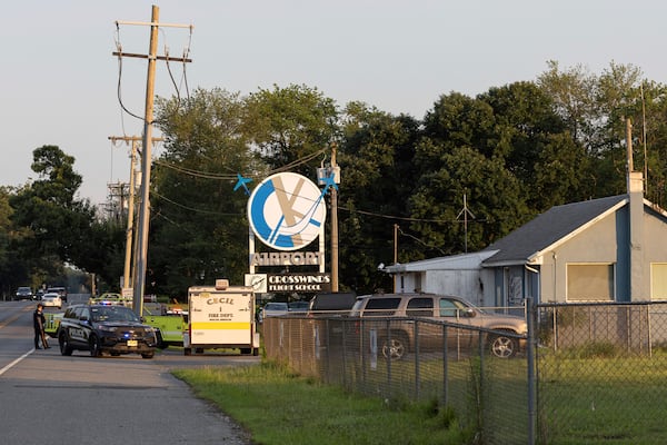 First responders work the scene at Cross Keys Airport in Gloucester County, N.J., after a skydiving aircraft went off the end of a runway and crashed into the woods Wednesday, July 2, 2025. (Kaiden J. Yu/The Philadelphia Inquirer via AP)