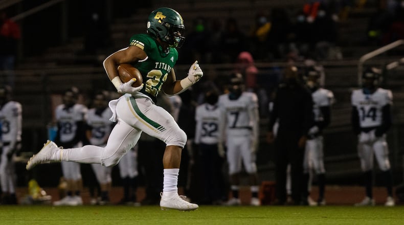 Justice Haynes (22) sophomore running back for Blessed Trinity, sprints to the end zone against Decatur High School during the second-round playoff game Friday, Dec. 4, 2020, in Roswell. Blessed Trinity won 44-0. (Christina Matacotta/For the AJC)