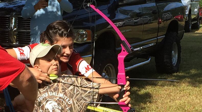 Davis Barnes of Marietta enjoys trying his hand at archery during a Greenwing Day event.