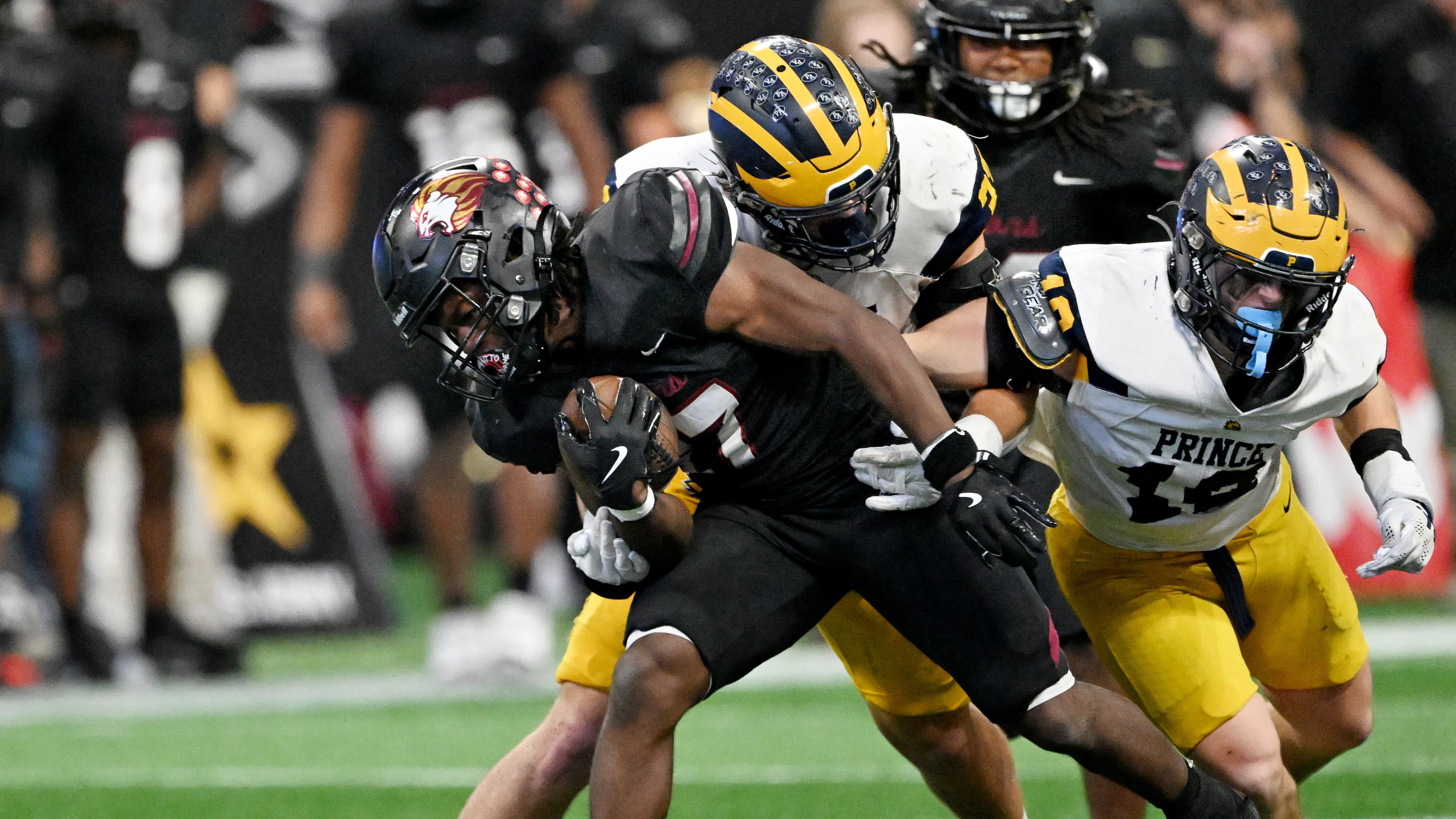 If the new GHSA playoff model were used in 2024, Mac Bradley (center, behind Hebron Christian's Devon Caldwell) and eventual 3A-A runner-up Prince Avenue Christian would've been seeded 10th for the playoffs. (Hyosub Shin/AJC)