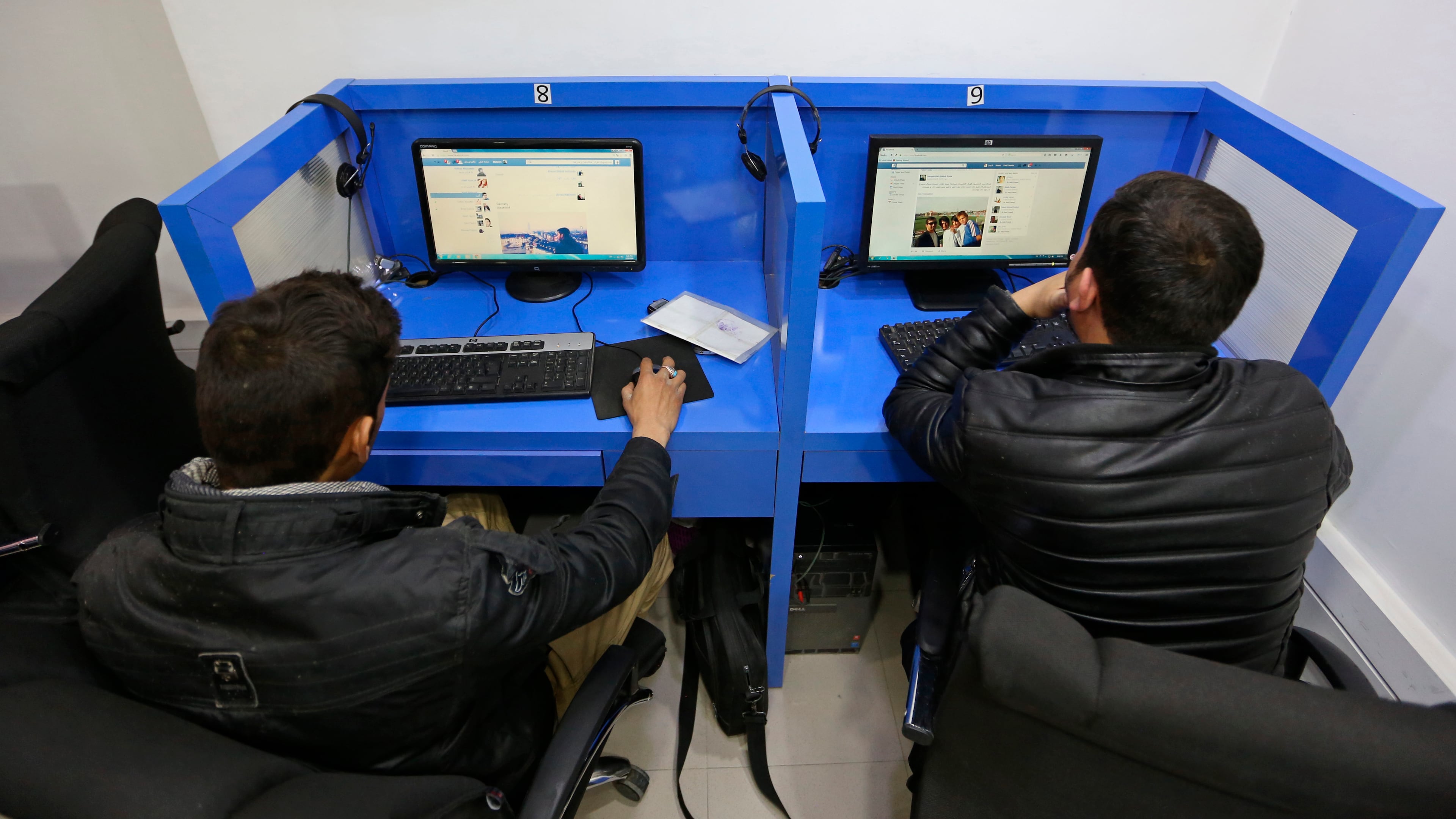 FILE - In this Feb. 10, 2016 photo, Afghanis access social media websites at a private internet cafe in Kabul, Afghanistan. (AP Photo/Rahmat Gul, file)