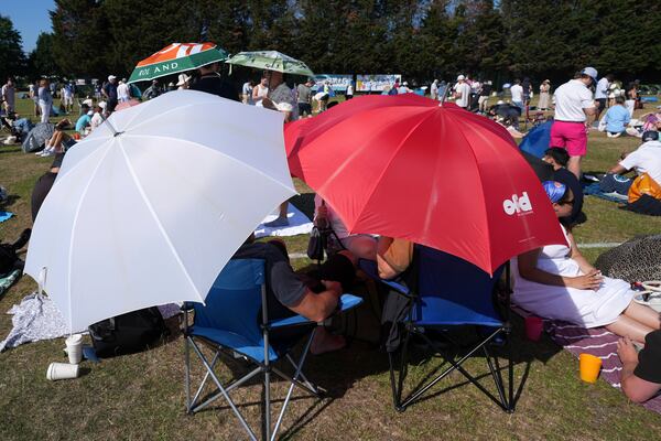 People queue at the entrance on the first day of the Wimbledon Tennis Championships in London, Monday, June 30, 2025. (AP Photo/Alastair Grant)