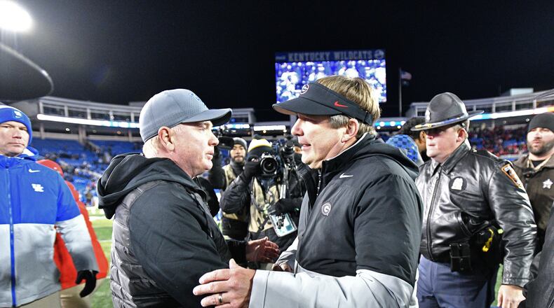 November 19, 2022 Lexington, KY - Kentucky's head coach Mark Stoops (left) and Georgia's head coach Kirby Smart shake hands after Georgia beat Kentucky in an NCAA football game at Kroger Field in Lexington, KY on Saturday, November 19, 2022. Georgia won 16-6 over Kentucky. (Hyosub Shin / Hyosub.Shin@ajc.com)
