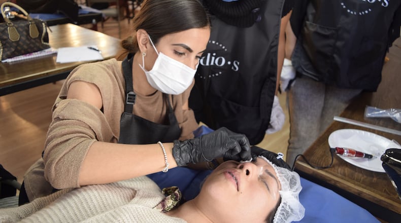 The city of Fayetteville will now allow licensed, permitted cosmetologists to perform eyebrow microblading. AJC file photo