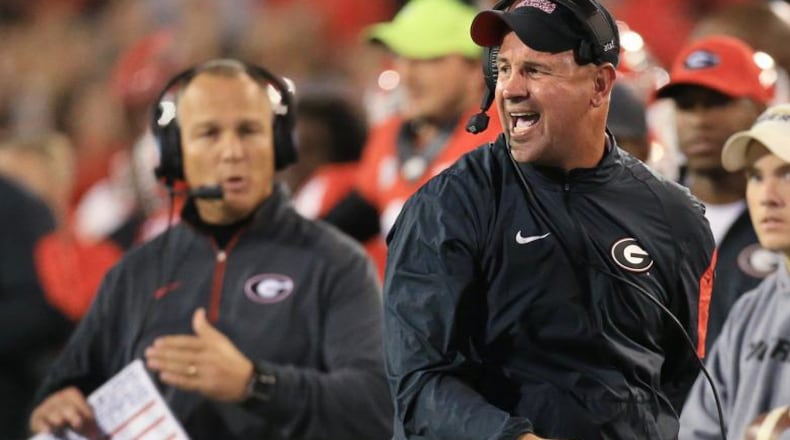 Georgia coach Mark Richt and defensive coordinator Jeremy Pruitt react on the sidelines as Georgia draws a penalty against Missouri on Saturday, Oct. 17, 2015, in Athens. (Curtis Compton/ccompton@ajc.com)