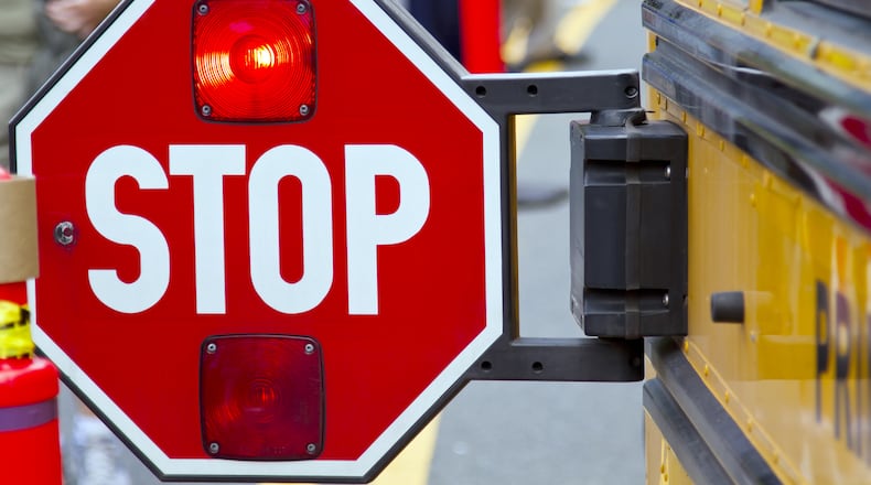A school district in Ohio has installed cameras on the side of school buses to deter people from speeding through the signs.