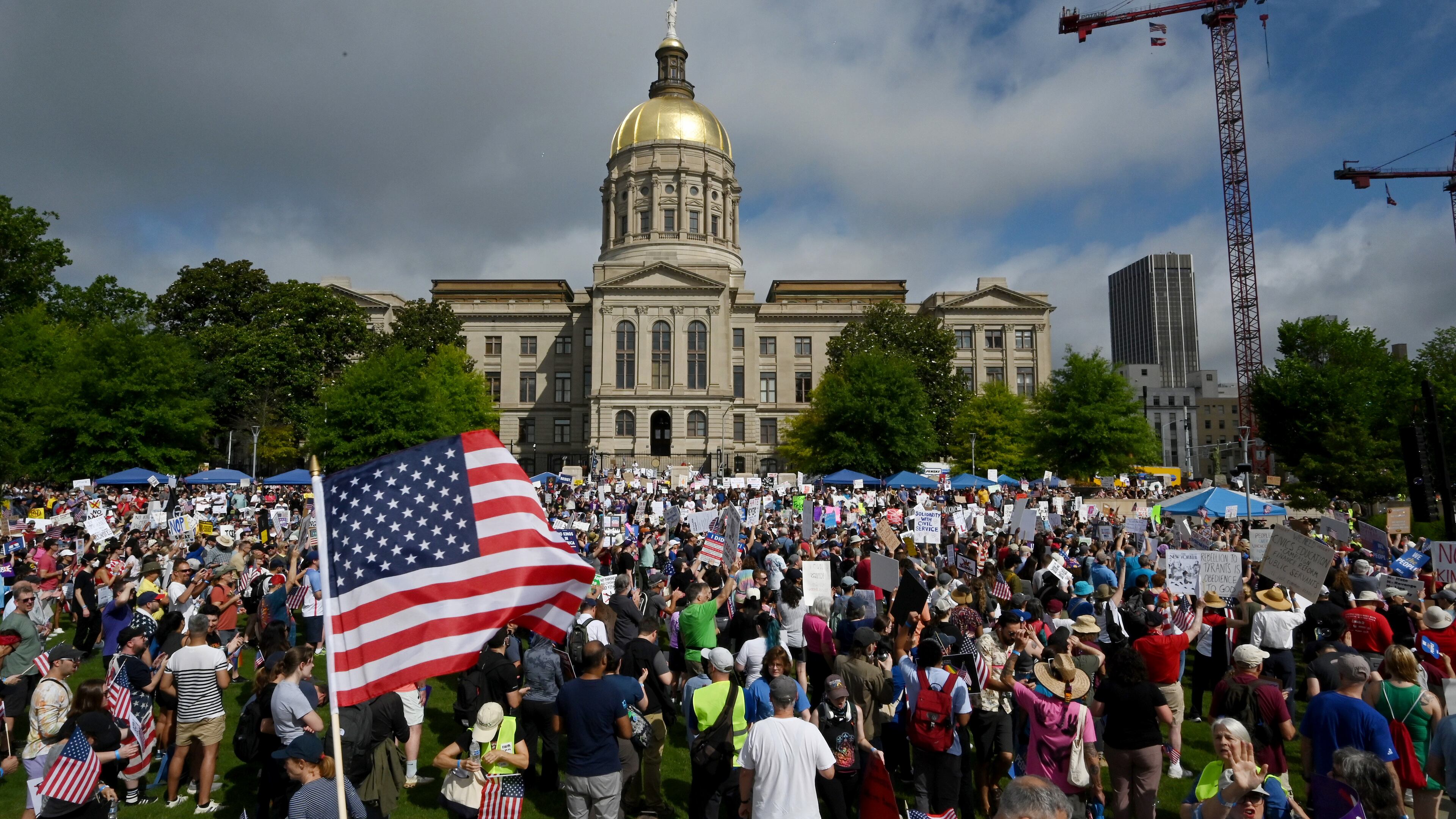Demonstrators gather at Liberty Plaza, near the Georgia Capitol, for a "No Kings" protest to oppose President Donald Trump’s immigration policies Saturday in Atlanta. (Hyosub Shin/AJC)