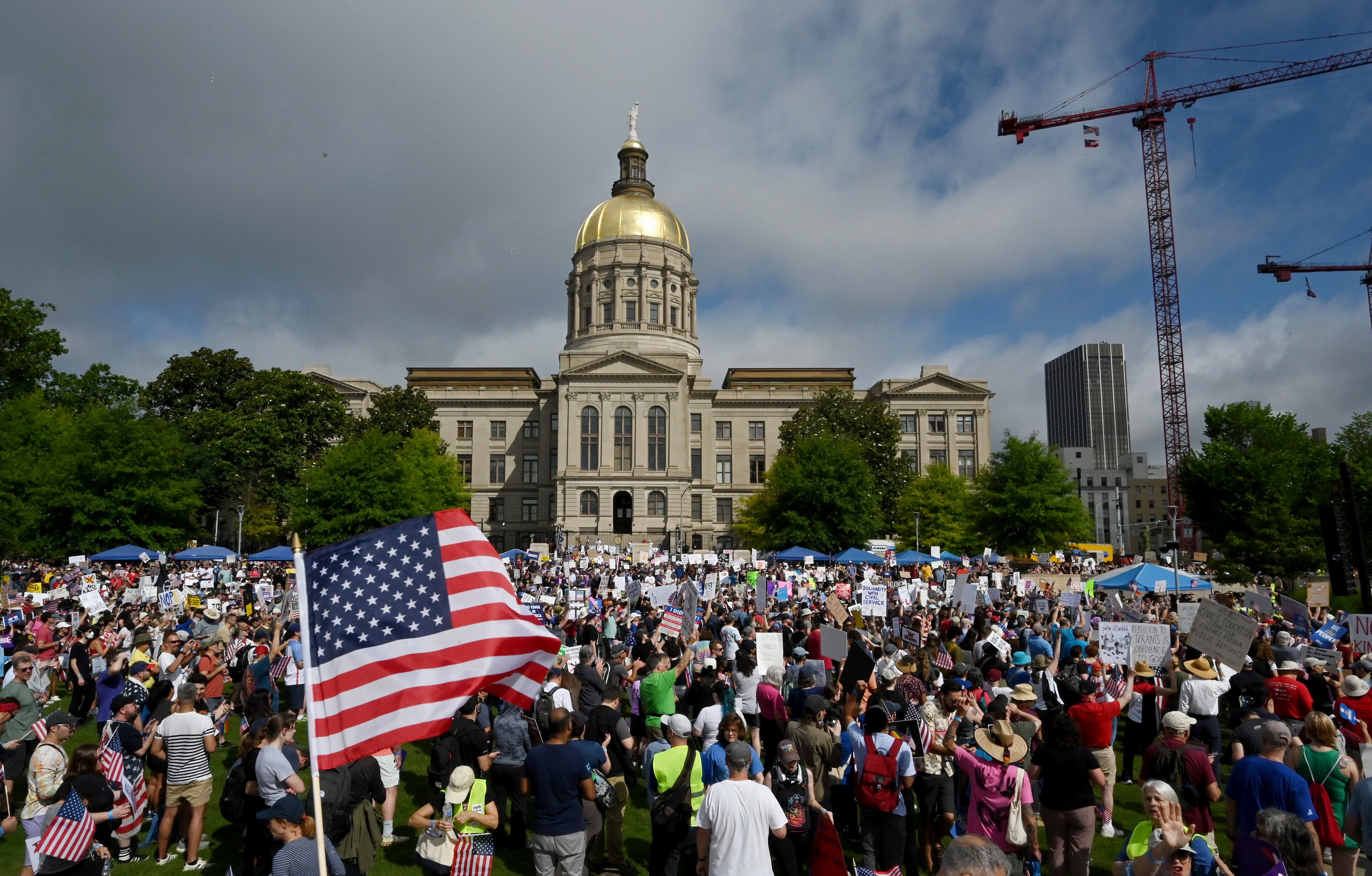 Demonstrators gather at Liberty Plaza, near the Georgia Capitol, for a "No Kings" protest to oppose Trump’s immigration policies, Saturday, June 14, 2025, in Atlanta. (Hyosub Shin / AJC)