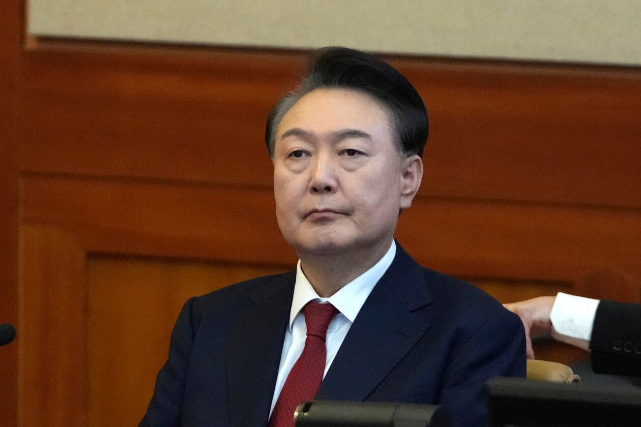 FILE - South Korea's impeached President Yoon Suk Yeol attends a hearing of his impeachment trial at the Constitutional Court in Seoul, South Korea, Feb. 11, 2025. (AP Photo/Lee Jin-man, Pool, File)