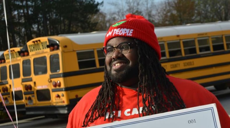 Radloff Middle School bus driver Jamario Felder is being hailed a hero for actions he took to save a student who was unconscious on his bus in August. The Rotary Club of Duluth presented its Hidden Hero Award to Felder on Dec. 17. (Photo Courtesy of Curt Yeomans)