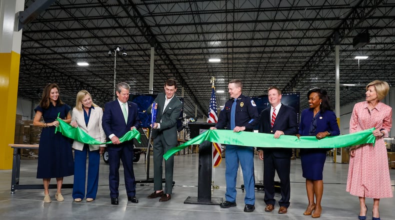 Garrett Langley (fourth from left), CEO and founder of Flock Safety, and Gov. Brian Kemp join other special guests during a ribbon-cutting ceremony on April 2, 2025, to inaugurate a new 97,000-square-foot facility in Smyrna, Ga. This facility is intended to serve as the center for the manufacturing operations of the company’s technology safety products.
(Miguel Martinez/AJC)