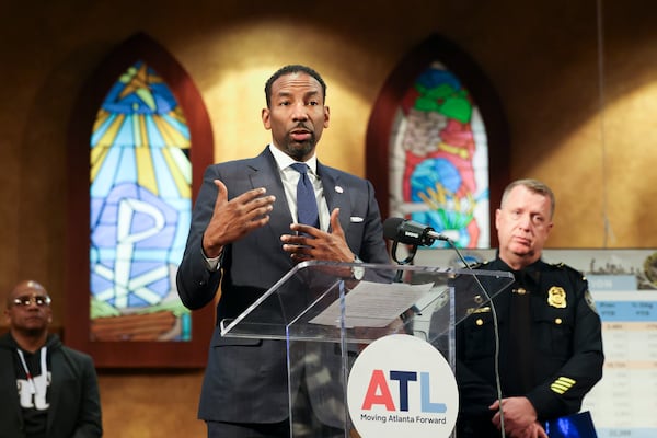 Atlanta Mayor Andre Dickens and Atlanta Police Department Chief Darin Schierbaum, right, tout the decline in homicides in Atlanta. (Jason Getz / AJC file)