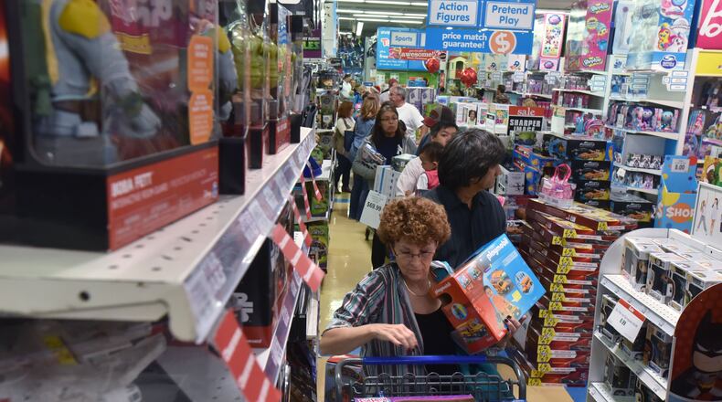 In this November 2016 file photo, the checkout area at the Kennesaw Toys R Us was a busy place during the early Black Friday (or Gray Thursday) sale.