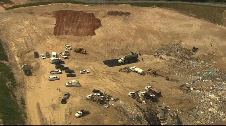 Authorities are investigating after a body was found in a North Georgia landfill.