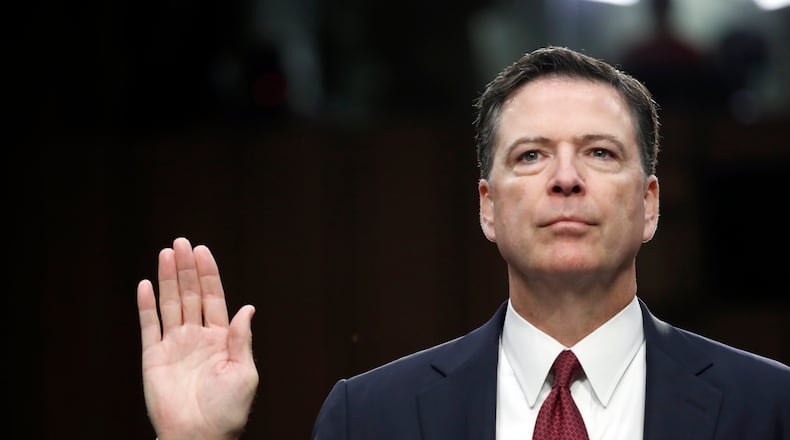 Former FBI Director James Comey is sworn in during a Senate Intelligence Committee hearing on Thursday. AP/Alex Brandon