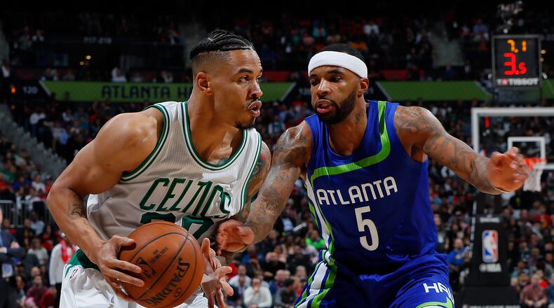 ATLANTA, GA - JANUARY 13: Malcolm Delaney #5 of the Atlanta Hawks defends against Gerald Green #30 of the Boston Celtics at Philips Arena on January 13, 2017 in Atlanta, Georgia. NOTE TO USER User expressly acknowledges and agrees that, by downloading and or using this photograph, user is consenting to the terms and conditions of the Getty Images License Agreement. (Photo by Kevin C. Cox/Getty Images)