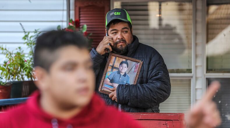 October 16, 2020 Clayton County: Santiago Zavala (center) holds a photo of his slain 13-year old son Brayan on Friday, Oct. 16, 2020 as Jesus Zavala (left) said he had no warning before his 13-year-old brother was shot and killed in front of him Thursday night in their front yard in Clayton County. The two were working on a lawn mower outside their home on Willow Lane, located in a mobile home community off Ga. 85 outside Riverdale. The elder brother barely noticed when a Chevrolet HHR pulled up to his neighbor’s house and a man climbed out, he said. “The shooter didn’t even say I want your money, or this is a robbery or I’m assaulting you,” Zavala, 16, told The Atlanta Journal-Constitution from outside his home on Friday. “He just came, stood there (in) silence and shot my brother. Just for killing.” Brayan Zavala was dead when Clayton County police officers arrived about 9:15 p.m. The Kendrick Middle School student was not a troublemaker, his brother said. He was a typical kid who spent most days with his family since the start of the coronavirus pandemic. Work, then home. Homework, then rest.
A Clayton County police spokesman on Thursday said investigators have yet to determine a connection between Brayan and the gunman. Investigators collected evidence at the mobile home park community overnight and declined to provide more information at the scene, Channel 2 Action News reported. The family has started a GoFundMe fundraiser to take Brayan’s body back to Mexico to be buried. (John Spink / John.Spink@ajc.com)