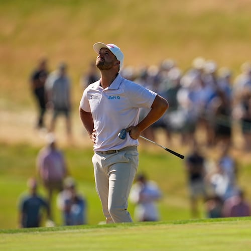 Wyndham Clark reacts to his shot on the ninth hole during the final round of the U.S. Open golf tournament at Shinnecock Hills Golf Club in Southampton, N.Y., Sunday, June 21, 2026. (AP Photo/George Walker IV)