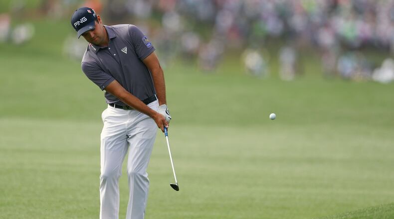 Corey Conners pitches to the green on 8 during the first round of the Masters Tournament Thursday, April 11, 2019, at Augusta National Golf Club in Augusta. Curtis Compton / ccompton@ajc.com