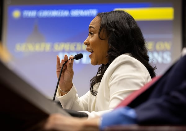 Fulton County District Attorney Fani Willis testifies before a state Senate committee at the Capitol in Atlanta on Wednesday, Dec. 17, 2025. (Arvin Temkar/AJC)