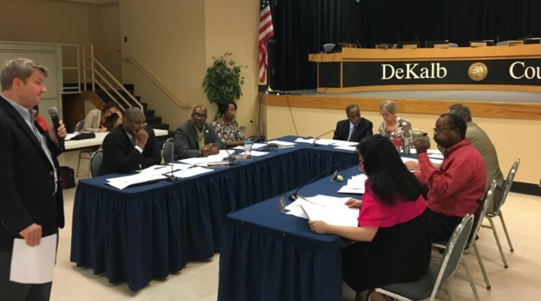 The DeKalb Board of Commissioners discussed road repairs and other projects that could be funded with a 1 percent sales tax increase at Maloof Auditorium in Decatur on Thursday, July 20, 2017. From left: Deputy Chief Operating Officer Ted Rhinehart, Chief Operating Officer Zach Williams, Commissioner Greg Adams, Intergovernmental Affairs Manager Delores Crowell, CEO Mike Thurmond, Commissioner Nancy Jester, Commissioner Kathie Gannon, Commissioner Steve Bradshaw and Commissioner Jeff Rader. MARK NIESSE / MARK.NIESSE@AJC.COM