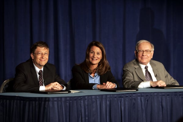FILE - Bill Gates, Melinda Gates and Warren Buffett speak to the media during a press conference, June 26, 2006 in New York. (AP Photo/Seth Wenig, File)