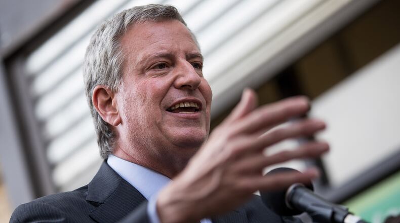 New York City Mayor Bill de Blasio speaks to the press in June 2018. On Jan. 8, 2019, de Blasio announced a plan to give every New Yorker comprehensive health care, regardless of ability to pay or citizenship status.