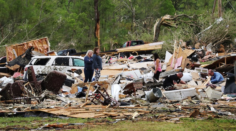 April 13, 2020 Chatsworth: Survivors and family friends dig through the remains of Deer Park trailer park after a deadly tornado killed at least 7 in Murray County on Monday, April 12, 2020, in Chatsworth. Curtis Compton ccompton@ajc.com