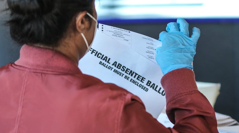 Fulton County election workers started counting and scanning ballots again on Wednesday Nov. 4, 2020 as the State and the Nation waited for the results. (John Spink / John.Spink@ajc.com)