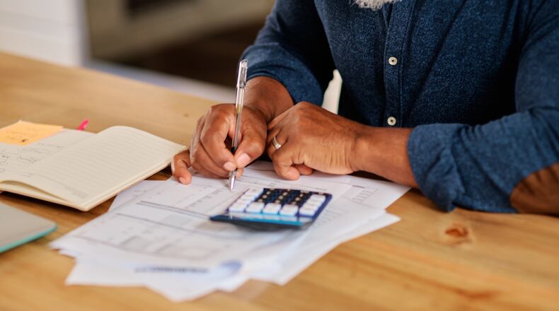 April is not only the month to pay state and federal income taxes. In Georgia, it’s also the deadline for many homeowners to apply for property tax exemptions. (SeizaVisuals/Getty Images)
