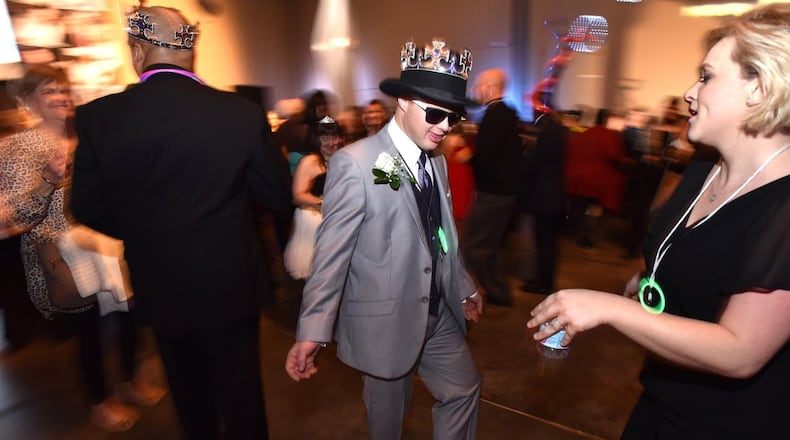 Dale Potter and his date, Becall Johns (right), dance during the “Night to Shine” event on Feb. 8 at First Baptist Church Atlanta in Dunwoody. HYOSUB SHIN / HSHIN@AJC.COM