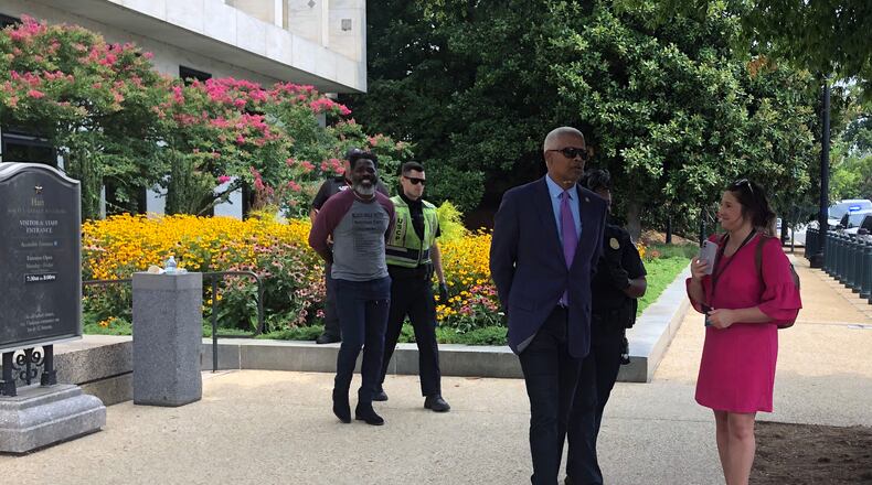 Georgia U.S. Rep. Hank Johnson, D-Lithonia, on the right, is arrested after participating in a voting rights demonstration outside a Senate office building on Capitol Hill in Washington on Thursday, July 22, 2021. (Tia Mitchell/The Atlanta Journal-Constitution)