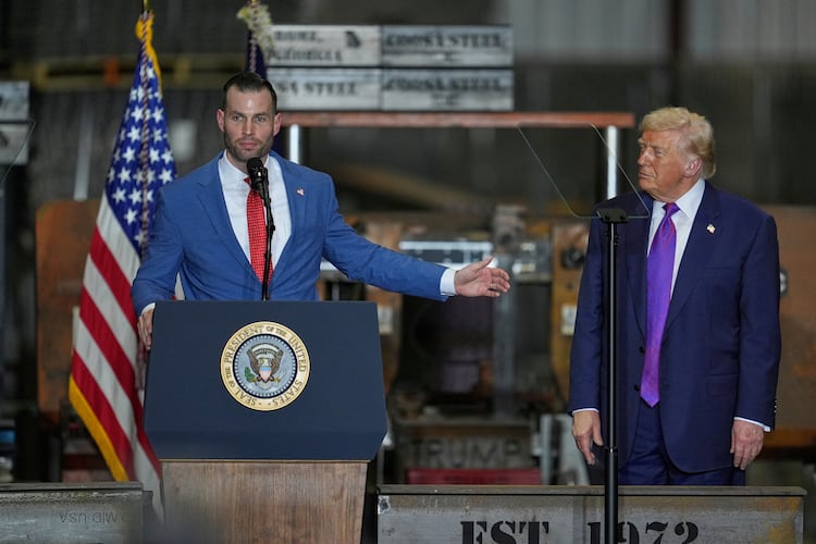 Former Floyd County District Attorney Clay Fuller (left) speaks as President Donald Trump listens during a rally at Coosa Steel Corp. on Thursday, Feb. 19, 2026, in Rome. Fuller won the special election to replace Marjorie Taylor Greene in Georgia’s 14th Congressional District. (George Walker IV/AP)