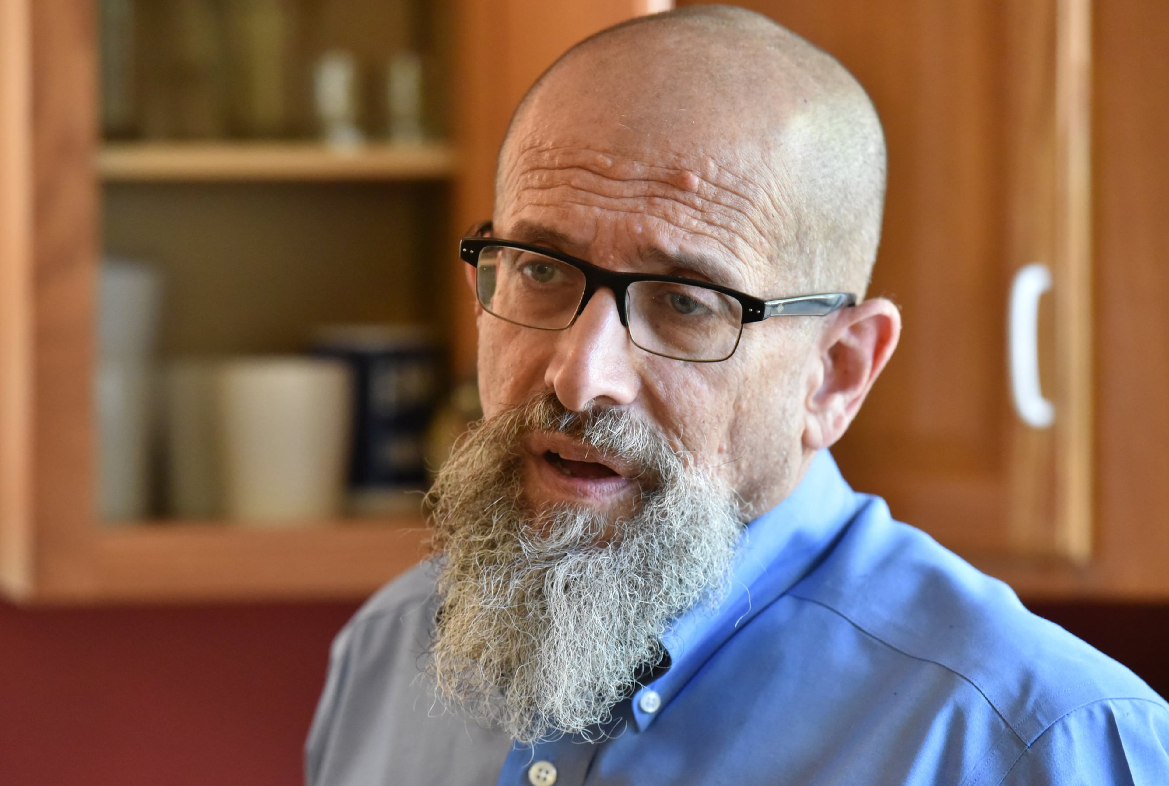 Immigration attorney Marty Rosenbluth stands in his kitchen in Lumpkin, Ga. The longtime human rights activist from North Carolina has bought a home in the tiny southwest Georgia city of Lumpkin, where he works in the shadow of one of the nation’s largest immigration detention centers. (Hyonsub Shin/AJC)