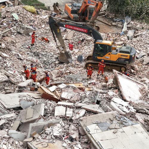 In this photo released by Xinhua News Agency, Rescuers conduct search and rescue at a collapsed building following a 5.2 magnitude earthquake hit in Liuzhou, in south China's Guangxi Zhuang Autonomous Region on Monday, May 18, 2026. (Li Hanchi/Xinhua via AP)