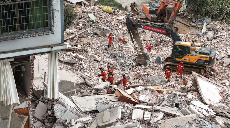 In this photo released by Xinhua News Agency, Rescuers conduct search and rescue at a collapsed building following a 5.2 magnitude earthquake hit in Liuzhou, in south China's Guangxi Zhuang Autonomous Region on Monday, May 18, 2026. (Li Hanchi/Xinhua via AP)