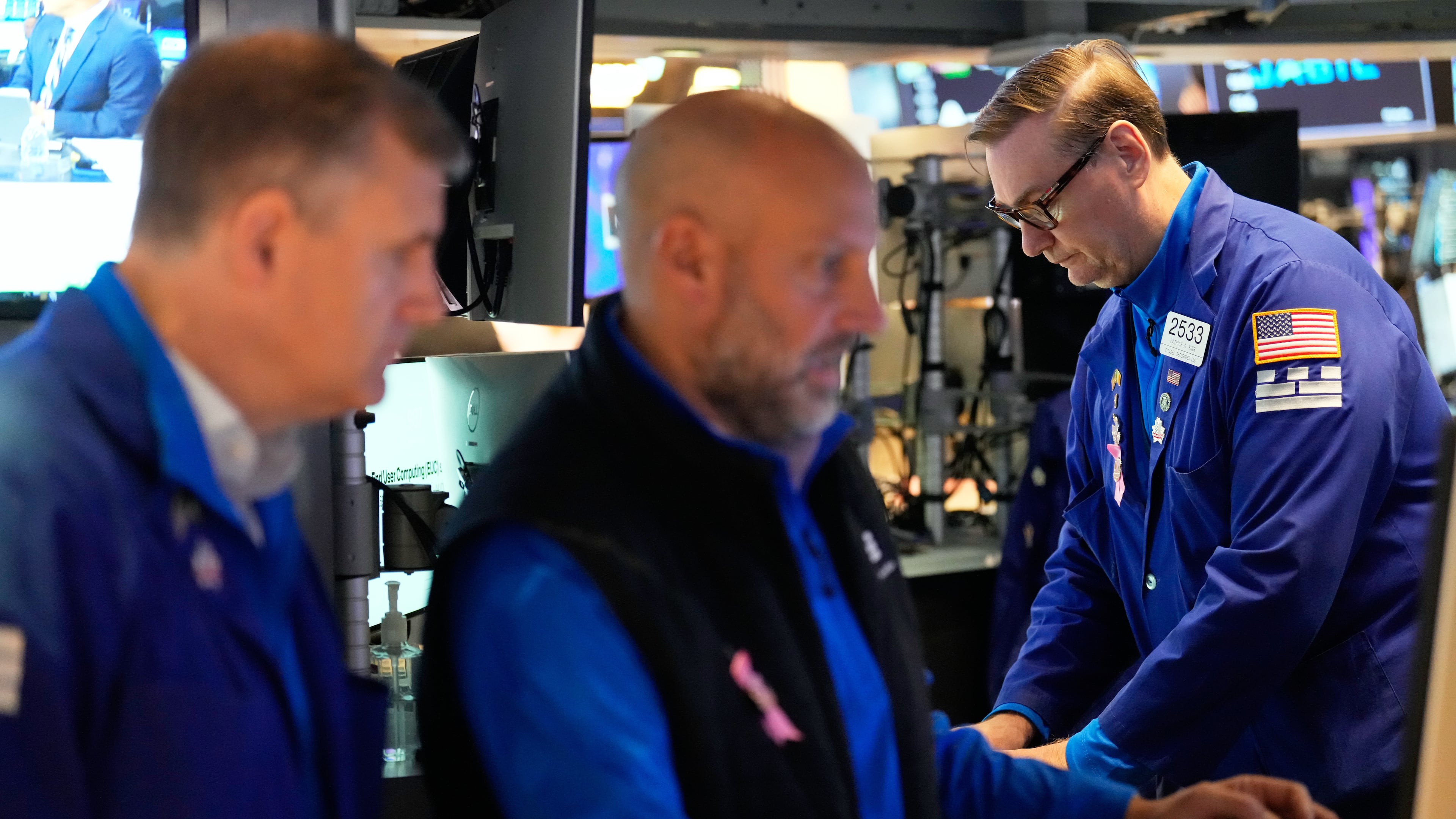 Patrick King, right, and others work on the floor at the New York Stock Exchange in New York, Wednesday, Oct. 1, 2025. (AP Photo/Seth Wenig)