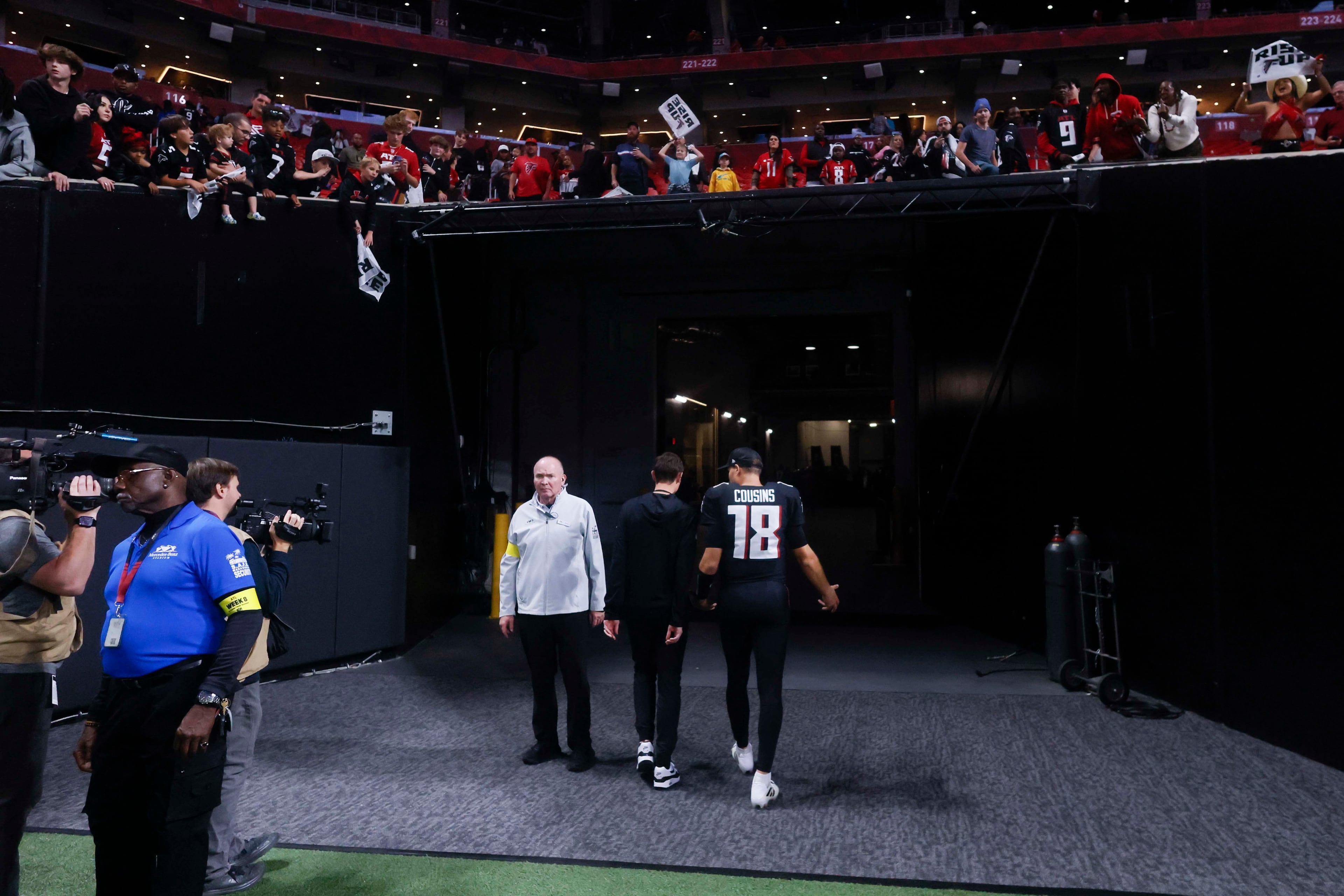 Atlanta Falcons quarterback Kirk Cousins leaves the field as some fans yell after the Atlanta Falcons lost 34-10 to the Miami Dolphins at Mercedes-Benz Stadium in Atlanta on Sunday, Oct. 26, 2025.  (Miguel Martinez/AJC)