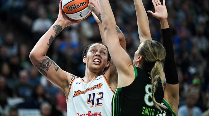 Brittney Griner (42) of the Phoenix Mercury shoots the ball over defender Alanna Smith (8) of the Minnesota Lynx in the second quarter in Game Two of Round One of the WNBA Playoffs at Target Center on Sept. 25, 2024, in Minneapolis. (Stephen Maturen/Getty Images/TNS)