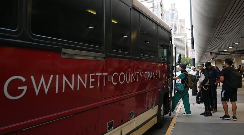 Customers get on Gwinnett County Transit bus at the Civic Center MARTA station, Thursday, Sept. 19, 2024, in Atlanta. (Hyosub Shin / AJC)