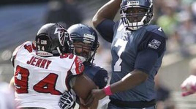Falcons defensive lineman Peria Jerry rushing the passer against Seattle in 2011. (Associated Press)