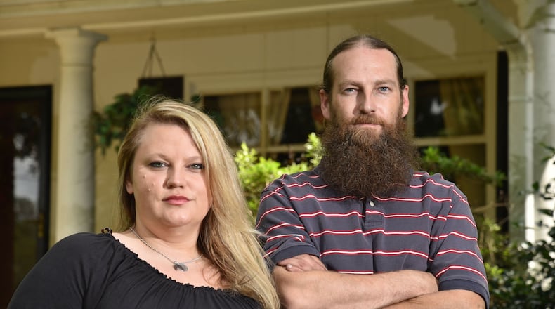 Sister and brother Jessica Sims and James Davis say a so-called “super-lien” robbed them of their inheritance, stripping them of their father’s childhood home. HYOSUB SHIN / HSHIN@AJC.COM