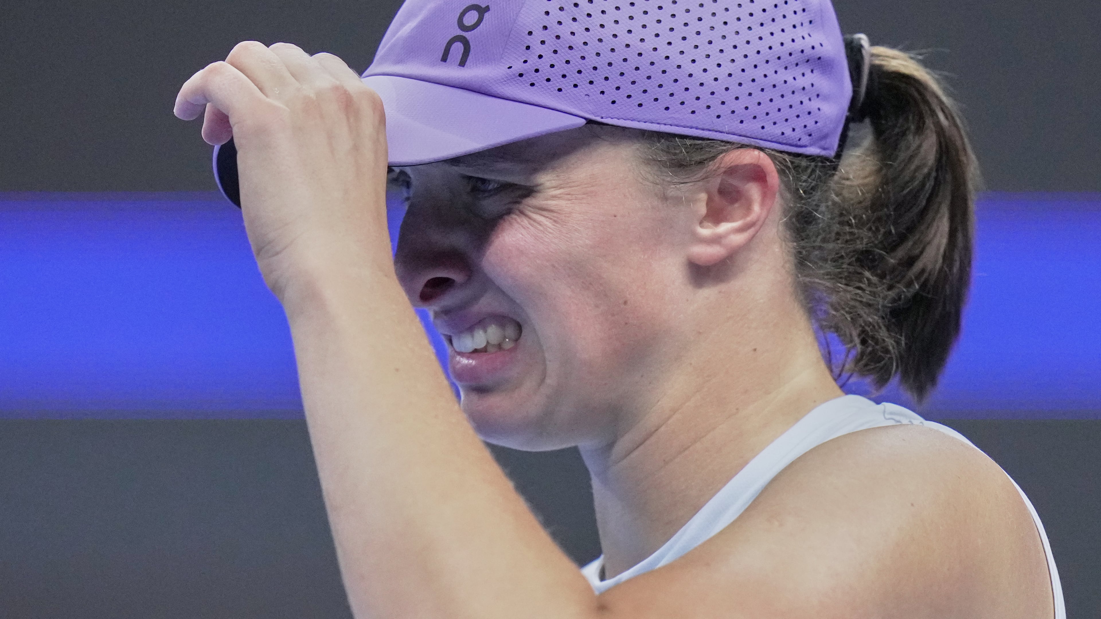 Iga Swiatek, of Poland reacts during the women's singles match against Emma Navarro, of the United States, in the China Open tennis tournament, at the National Tennis Center, in Beijing, Wednesday, Oct. 1, 2025. (AP Photo/Andy Wong)