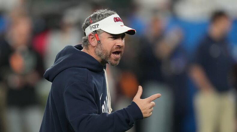 Mississippi head coach Pete Golding directs his players before the Fiesta Bowl NCAA college football playoff semifinal game against Miami, Thursday, Jan. 8, 2026, in Glendale, Ariz. (AP Photo/Ross D. Franklin)